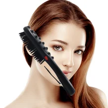 young woman with long hair using a vibrator comb