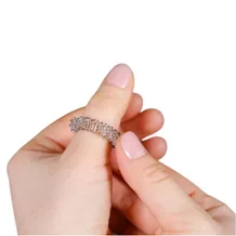 Fingers of a girl while using Sujok ring